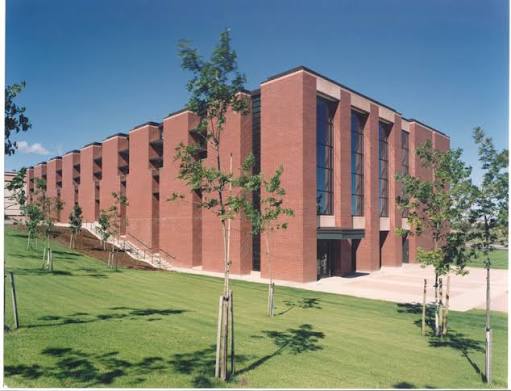 Three-story brick institutional building with projecting brick pilasters